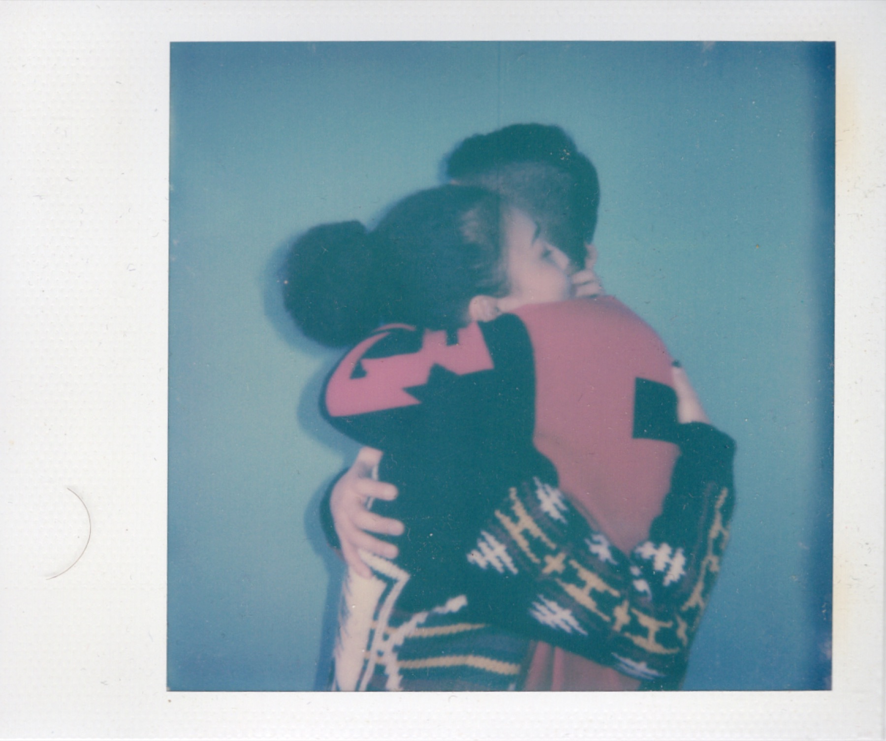Polaroid of two people embracing
