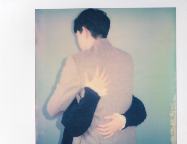Polaroid of two people holding each other