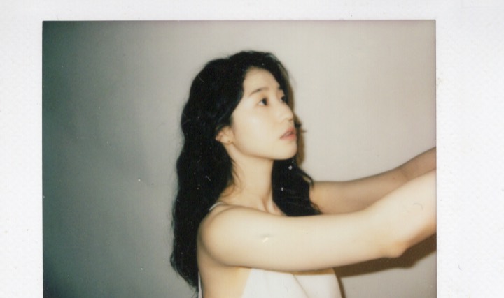 Profile portrait with raised arms