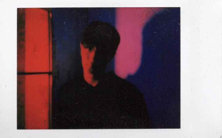 Polaroid portrait partially hidden by shadow
