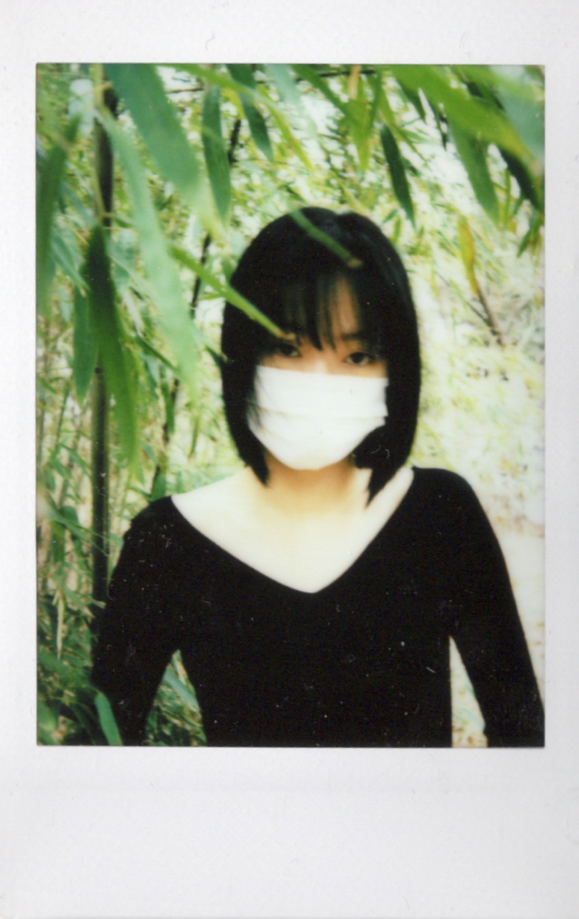 Polaroid portrait hidden behind a moving gesture