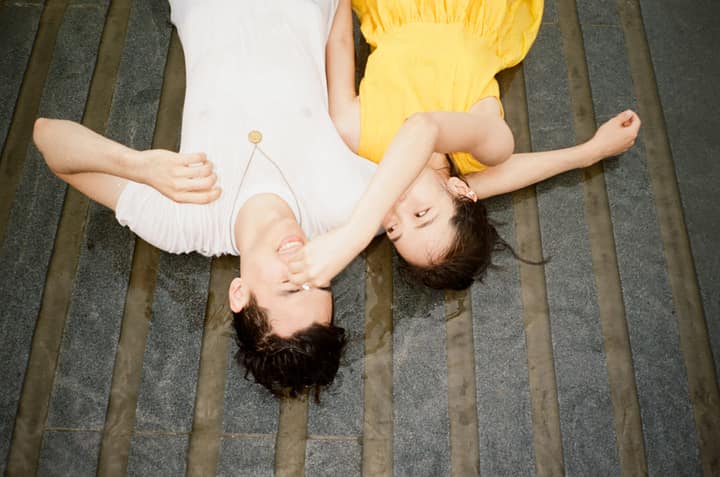Two people lying upside down in an untitled archive photograph
